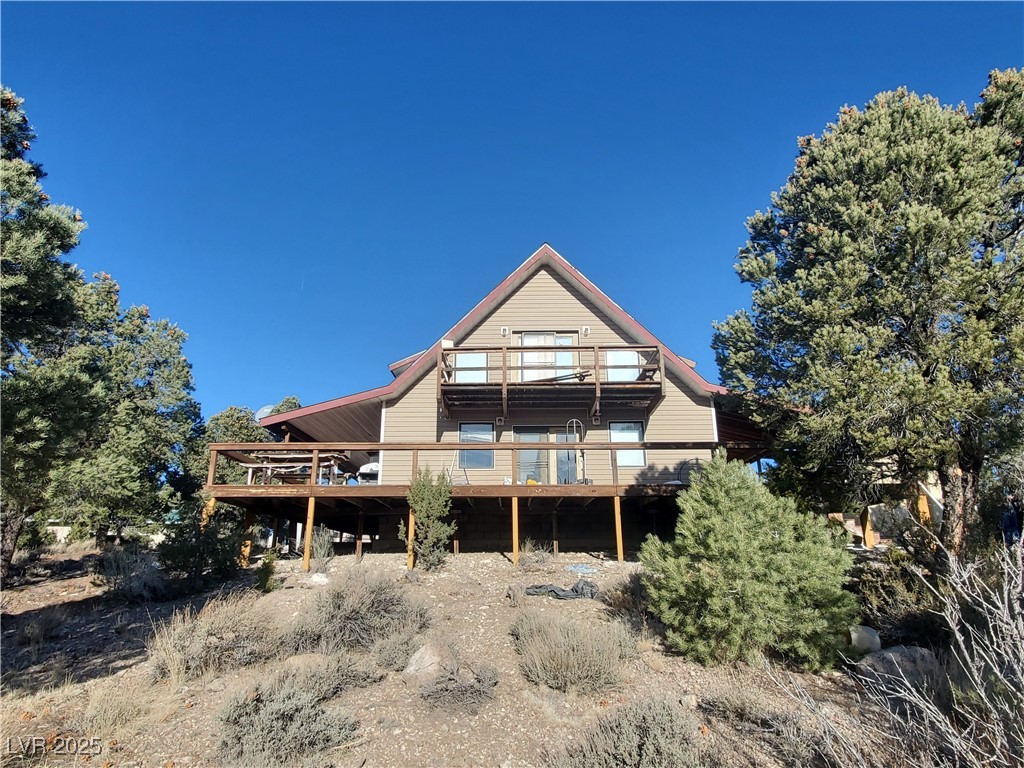 1281 Meadow Lane Pioche, NV 89043 - Photo 33 of 34 Rear view of house with a wooden deck
