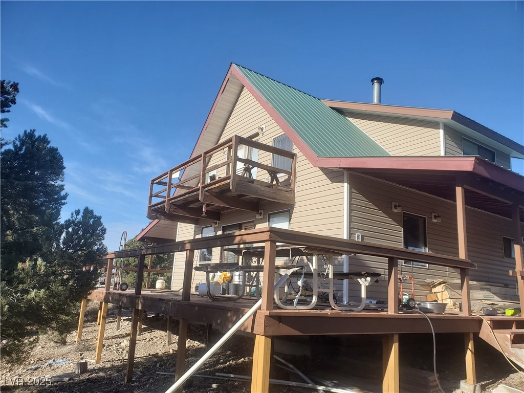 1281 Meadow Lane Pioche, NV 89043 - Photo 34 of 34 Rear view of house with a balcony and metal roof