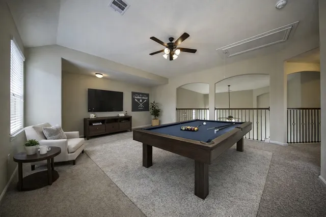 an empty room with windows and bathroom view