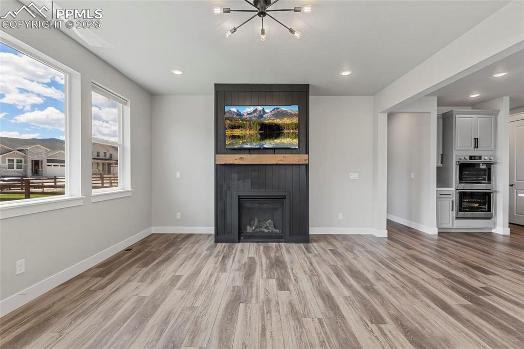 15777 Little Bluestem Road Monument, CO 80132 - Photo 4 of 50 a view of an empty room with a window and fire place