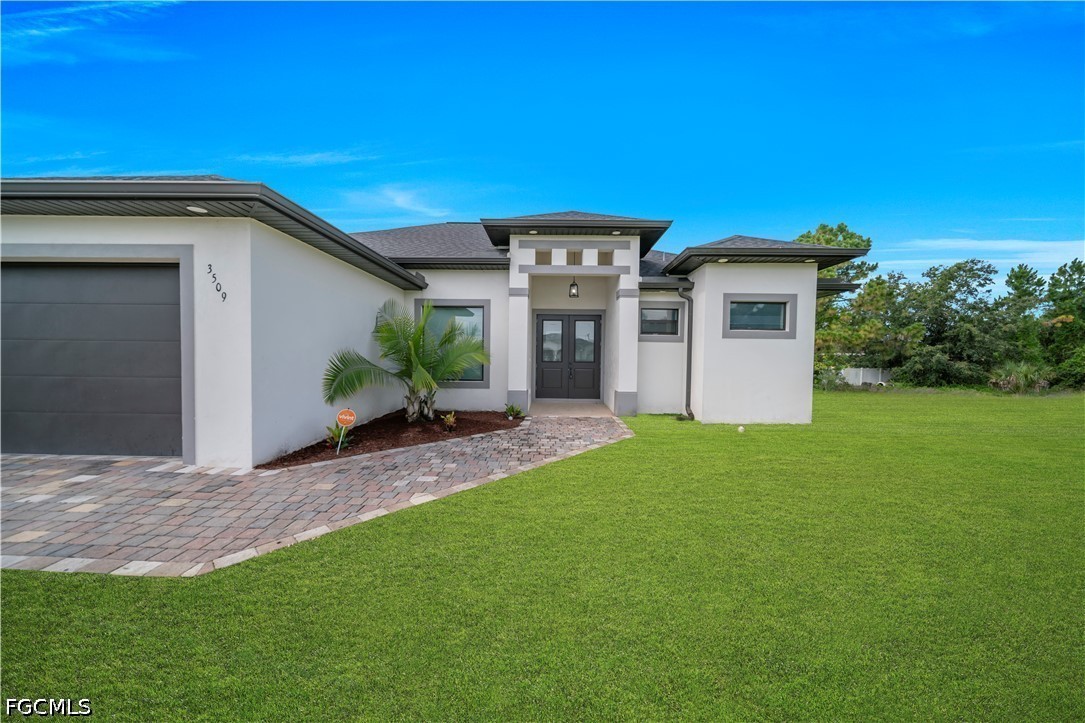 3509 38th Street Southwest Lehigh Acres, FL 33976 - Photo 9 of 47 a view of a house with a yard