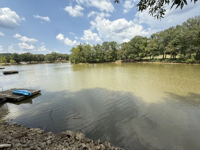 a front view of a house with trees
