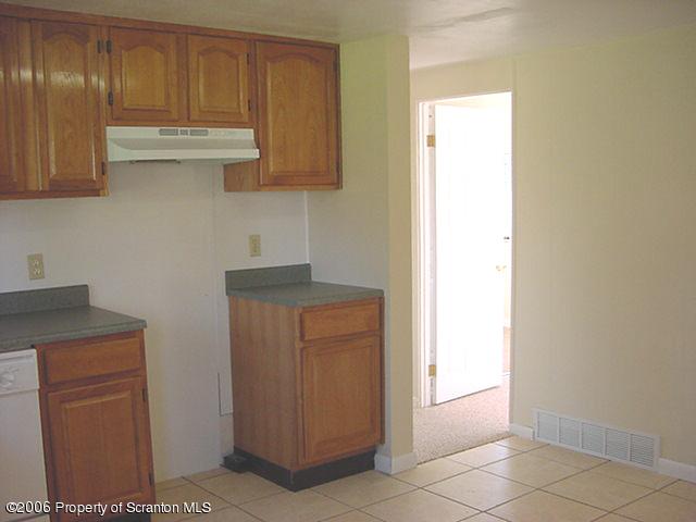 20 Mile Road Tunkhannock, PA 18657 - Photo 3 of 7 a kitchen with stainless steel appliances granite countertop a refrigerator and a stove