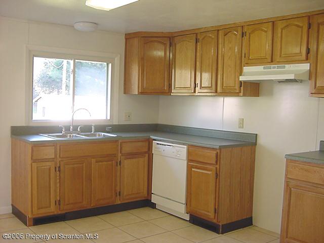 20 Mile Road Tunkhannock, PA 18657 - Photo 4 of 7 a kitchen with stainless steel appliances granite countertop a sink and cabinets