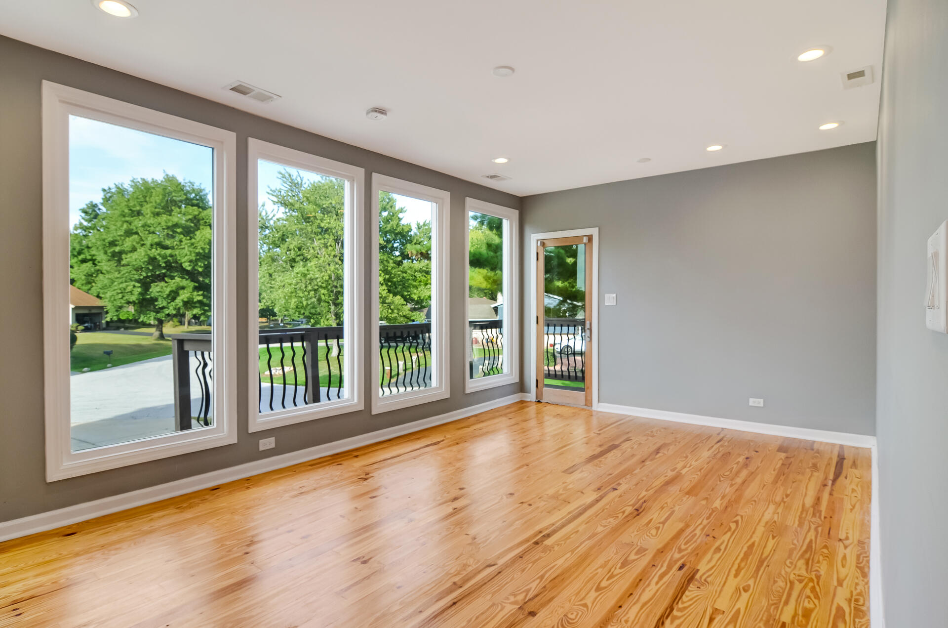 2212 Elm Tree Lane Crown Point, IN 46307 - Photo 19 of 33 a view of an empty room with wooden floor and a window