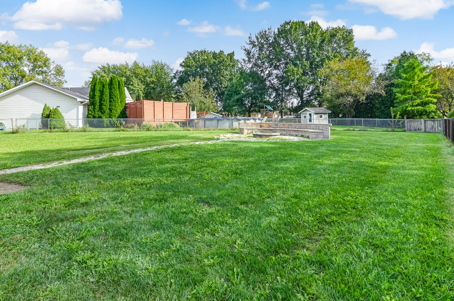 2212 Elm Tree Lane Crown Point, IN 46307 - Photo 4 of 33 a view of house with backyard and a garden