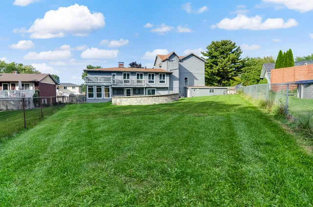 a view of a house with a big yard
