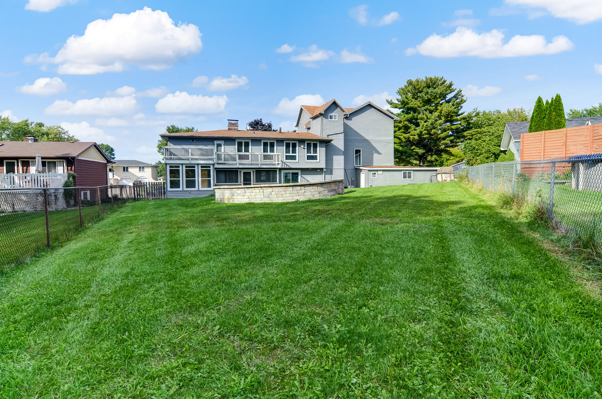 2212 Elm Tree Lane Crown Point, IN 46307 - Photo 5 of 33 a view of a house with a big yard