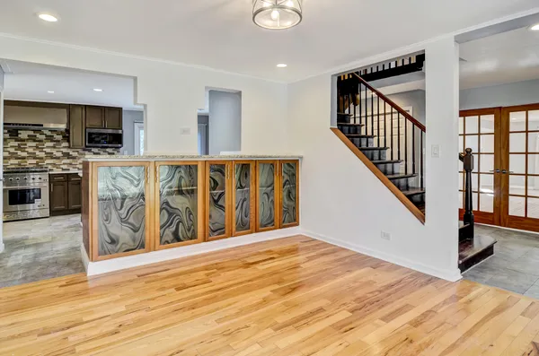 a view of an entryway with wooden floor