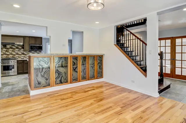 a view of an entryway with wooden floor