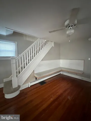 a view of entryway with wooden floor