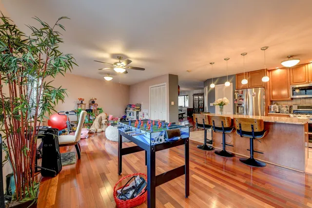 a view of a livingroom with furniture and a potted plant