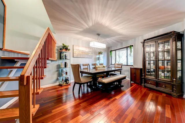 a room with lots of furniture and wooden floor