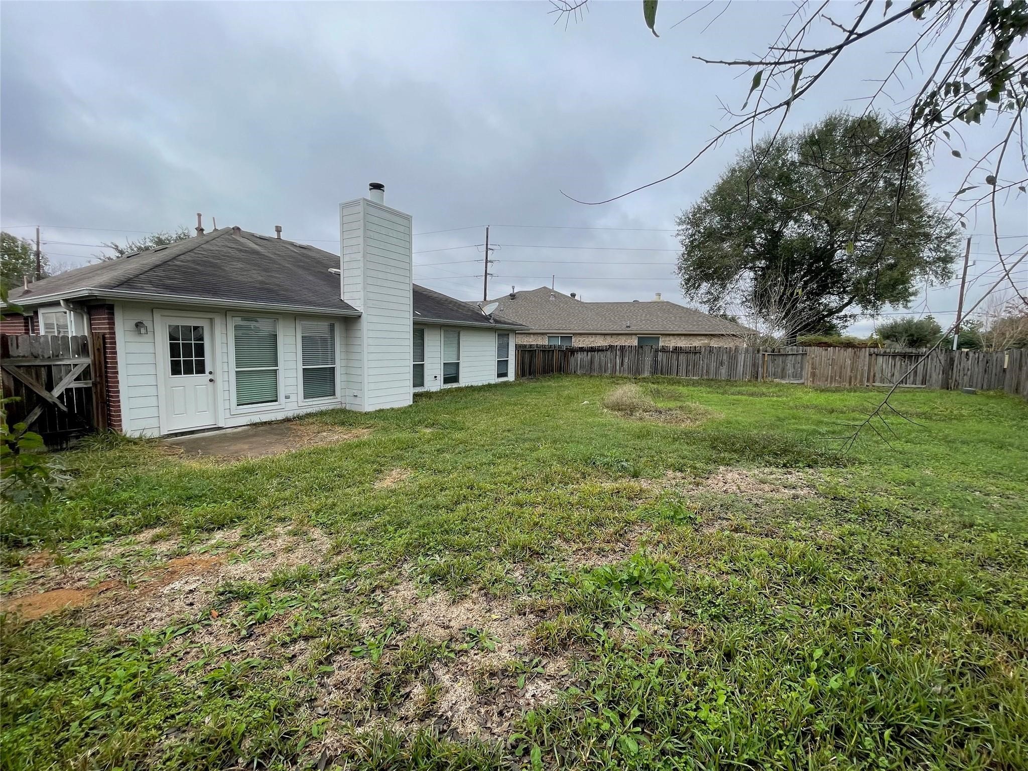 3310 North Mason Road Katy, TX 77449 - Photo 14 of 14 a view of a house with a yard