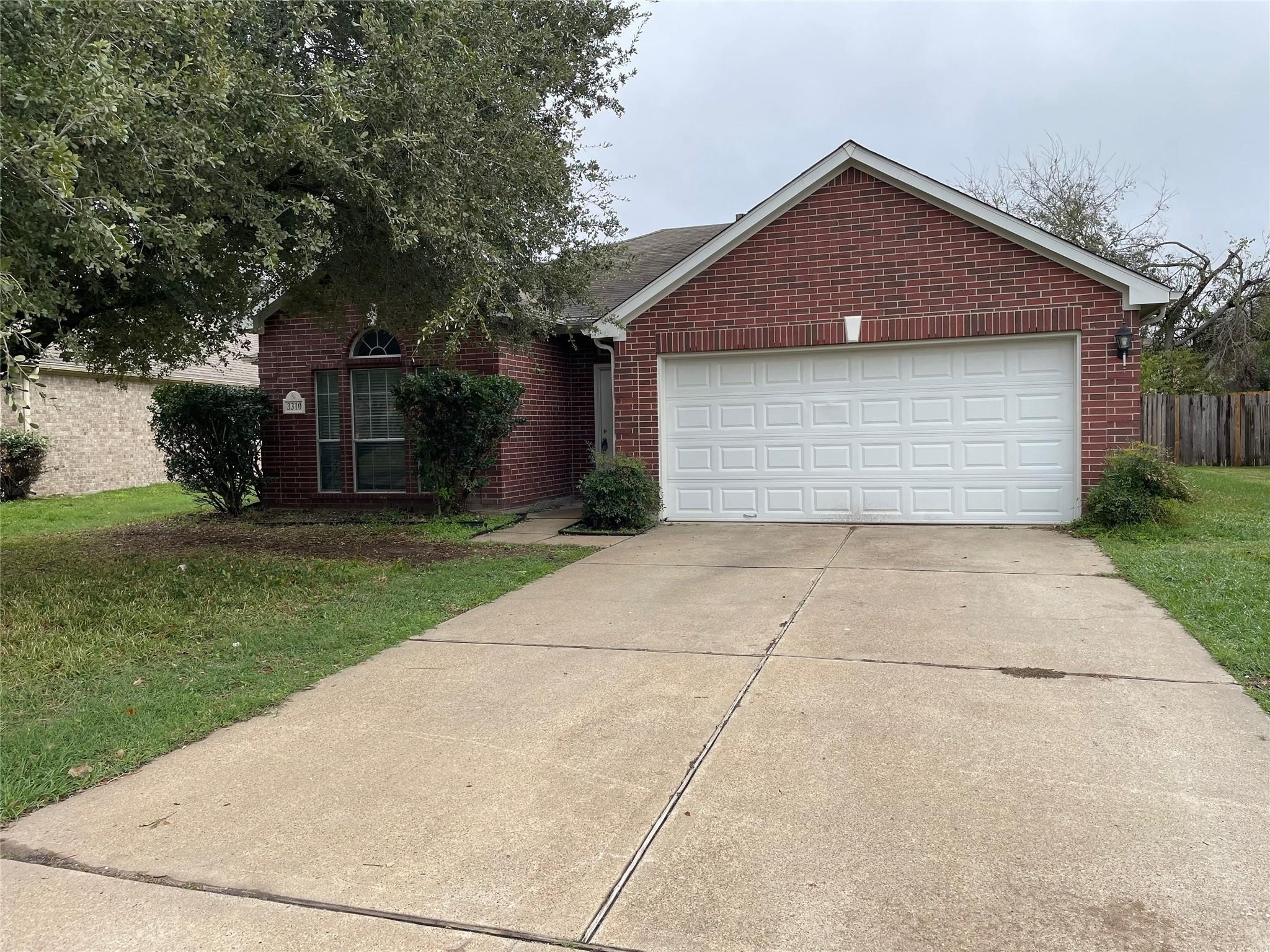 3310 North Mason Road Katy, TX 77449 - Photo 2 of 14 front view of house with a yard