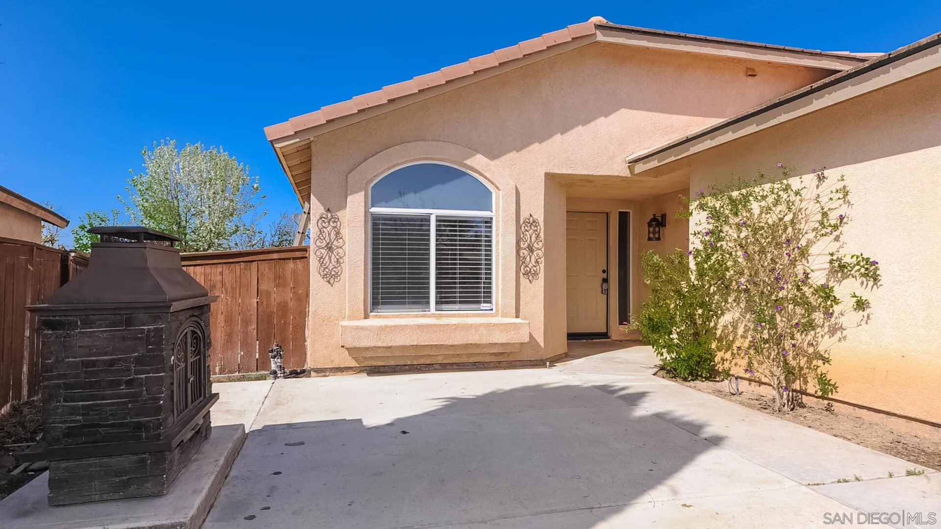 33092 Tulley Ranch Road Temecula, CA 92592 - Photo 2 of 24 a front view of a house with a yard