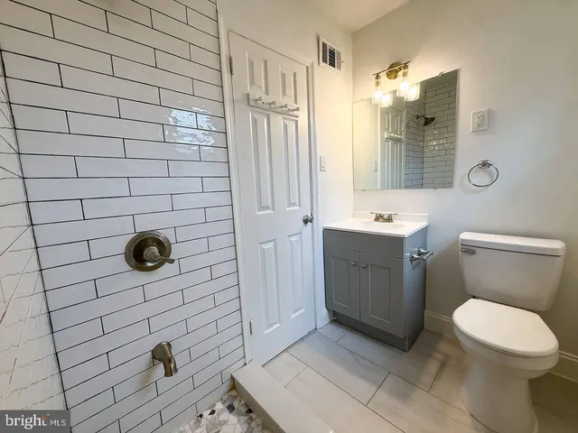 a bathroom with a toilet and a sink