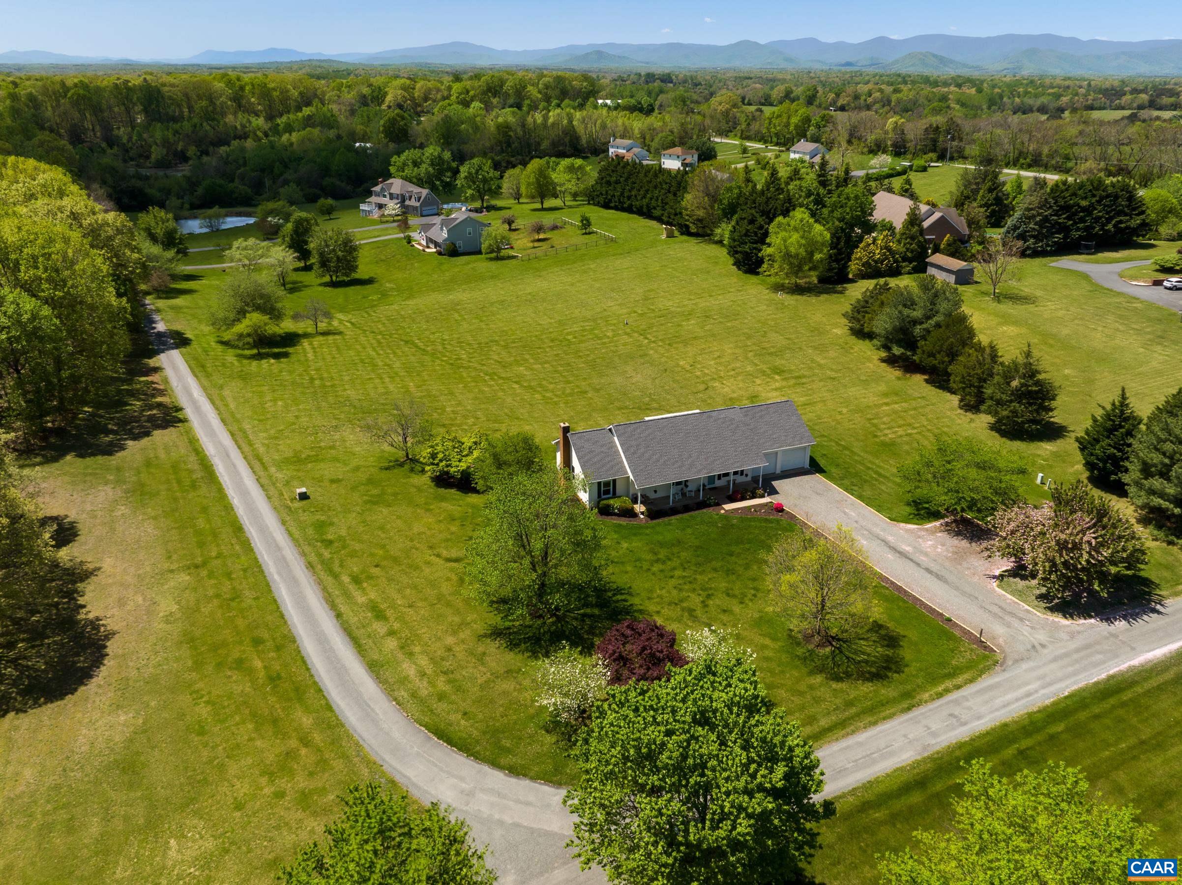 120 Meadowview Lane Ruckersville, VA 22968 - Photo 1 of 53 a view of a lake with a yard