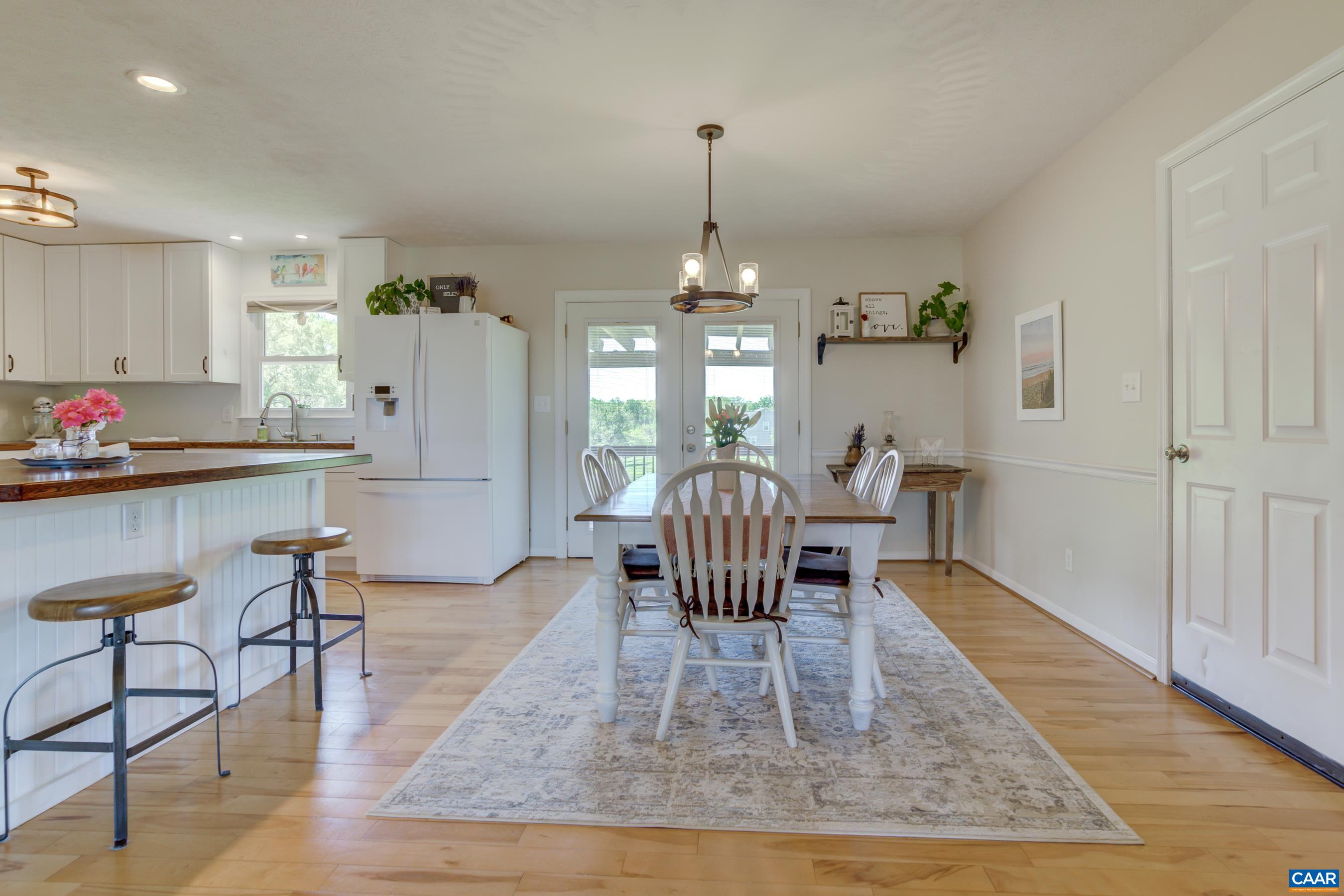120 Meadowview Lane Ruckersville, VA 22968 - Photo 11 of 53 a view of a dining room with furniture and wooden floor