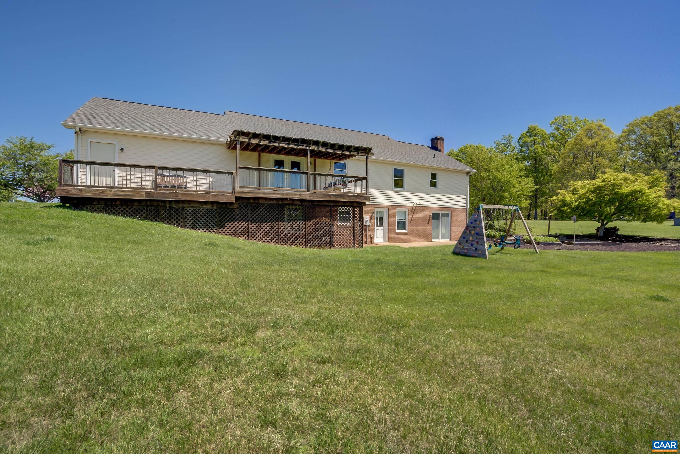 120 Meadowview Lane Ruckersville, VA 22968 - Photo 42 of 53 a view of a big house with a big yard and large trees