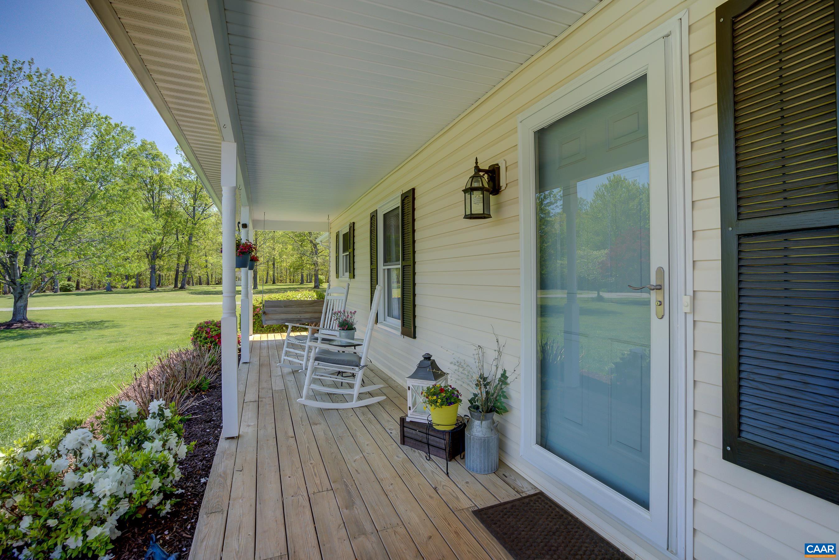 120 Meadowview Lane Ruckersville, VA 22968 - Photo 6 of 53 a view of a balcony with chair and wooden floor