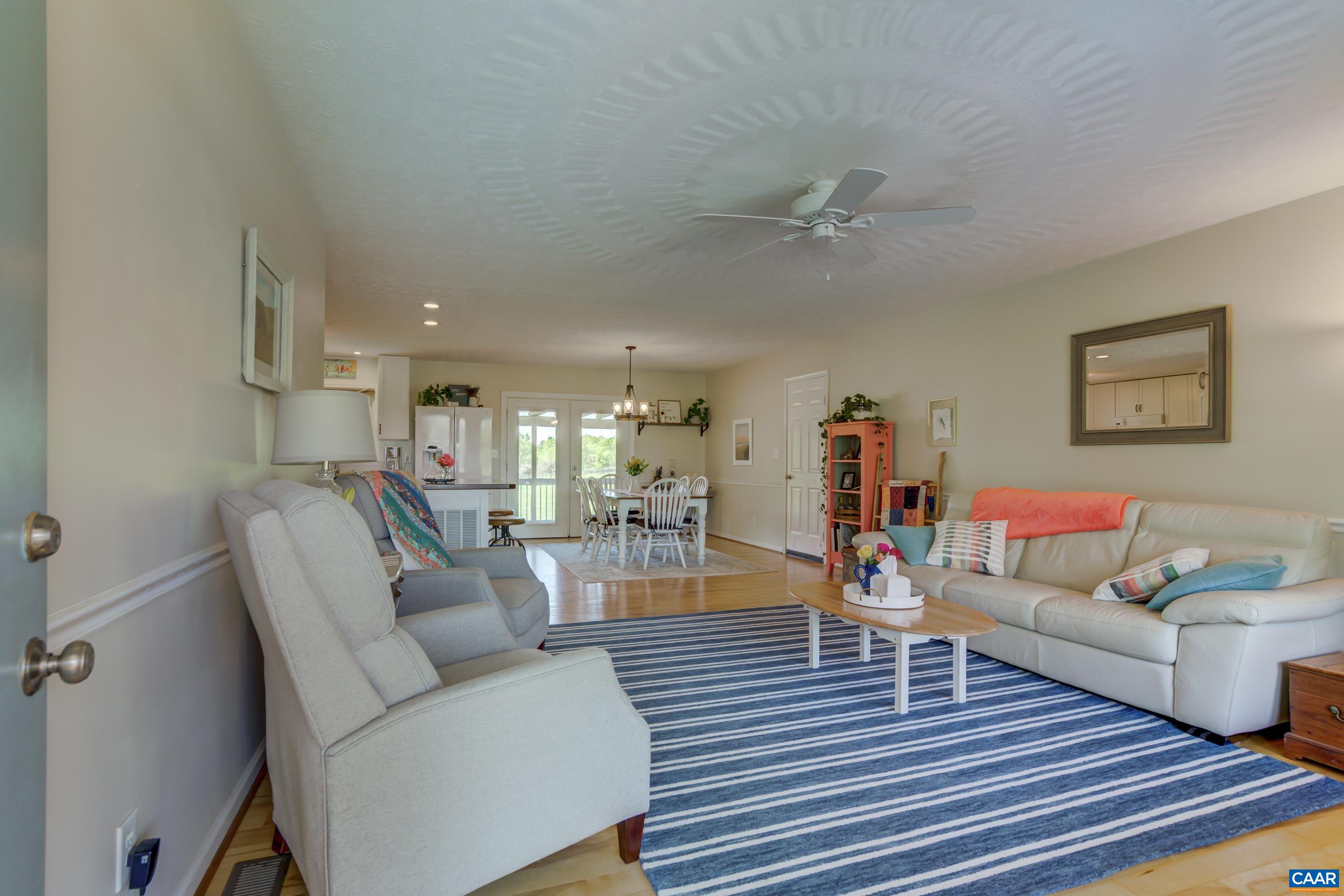 120 Meadowview Lane Ruckersville, VA 22968 - Photo 7 of 53 a living room with furniture and a wooden floor
