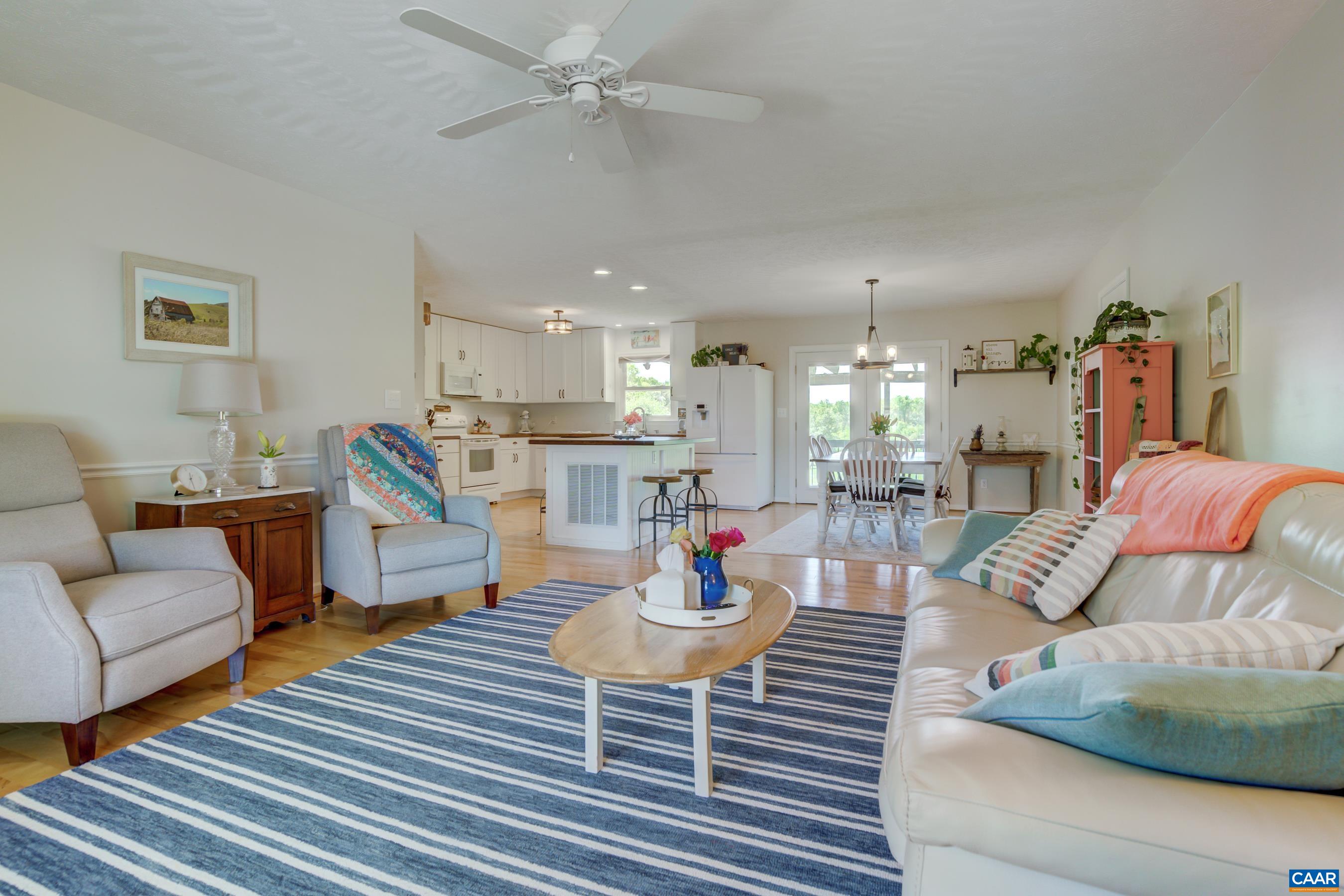 120 Meadowview Lane Ruckersville, VA 22968 - Photo 10 of 53 a living room with furniture and a wooden floor