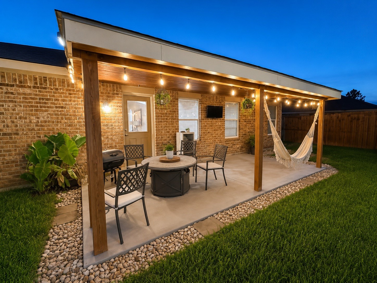 9911 Bronze Mill Lane Rosharon, TX 77583 - Photo 15 of 15 Step outside to a large covered patio designed for year-round enjoyment, complete with ample room for outdoor dining and relaxation.