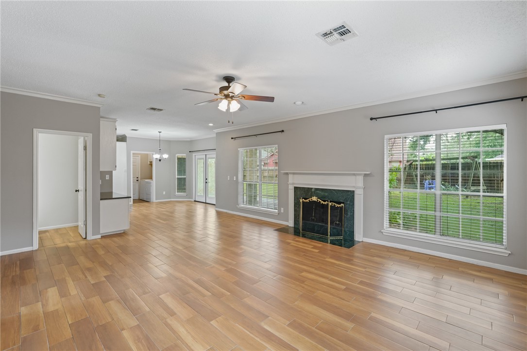7617 Del Rio Drive Corpus Christi, TX 78413 - Photo 11 of 32 a view of an empty room with a fireplace and a window