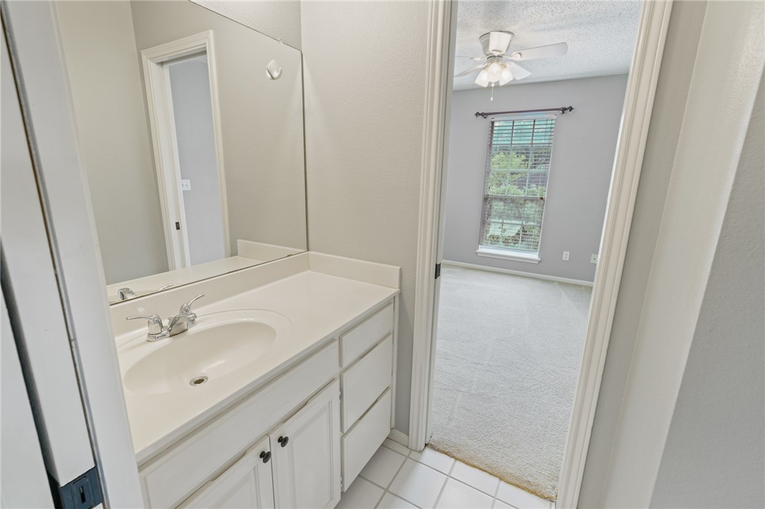 7617 Del Rio Drive Corpus Christi, TX 78413 - Photo 17 of 32 a bathroom with a sink a vanity and a mirror