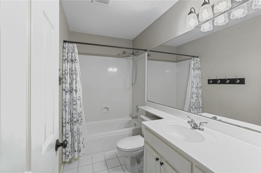 7617 Del Rio Drive Corpus Christi, TX 78413 - Photo 19 of 32 a bathroom with a sink a toilet and shower