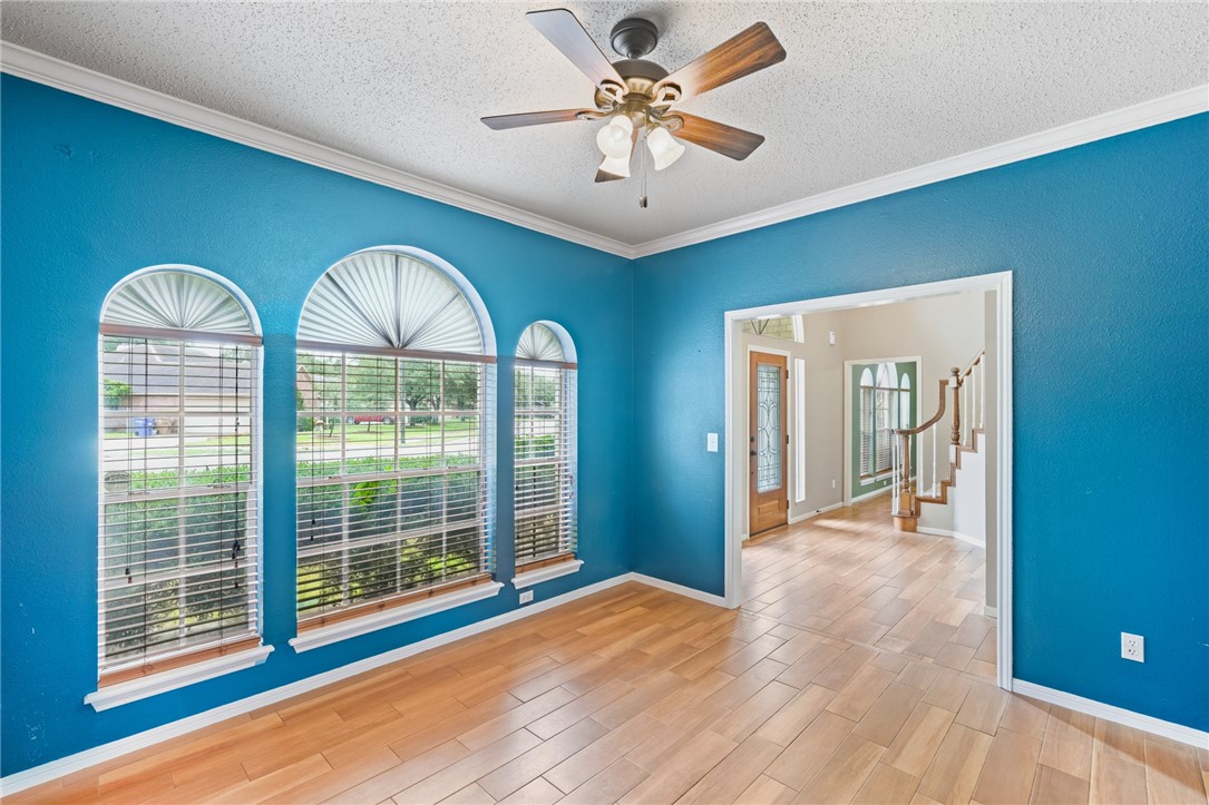 7617 Del Rio Drive Corpus Christi, TX 78413 - Photo 5 of 32 a view of empty room with wooden floor and fan