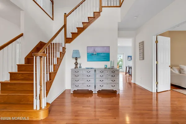 a kitchen with granite countertop a sink a counter top space and living room view