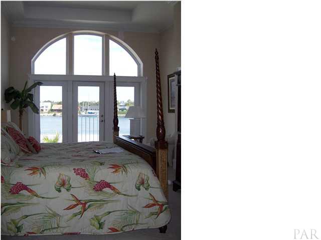 13810 River Road, Unit J1 Pensacola, FL 32507 - Photo 2 of 6 master bedroom overlooking intracoastal waterway