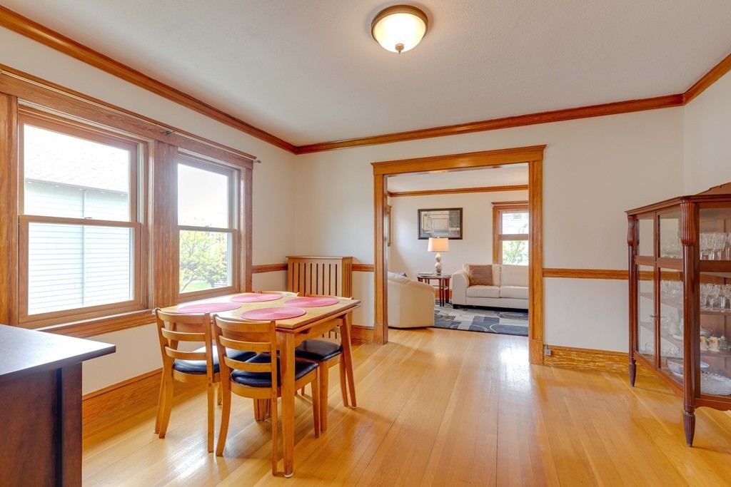4 Hilltop Road Watertown, MA 02472 - Photo 11 of 27 a view of a dining room with furniture window and wooden floor