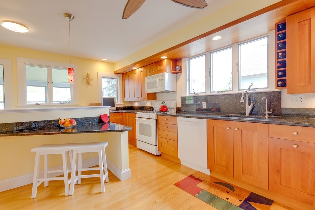 4 Hilltop Road Watertown, MA 02472 - Photo 12 of 27 a kitchen with a sink cabinets and window