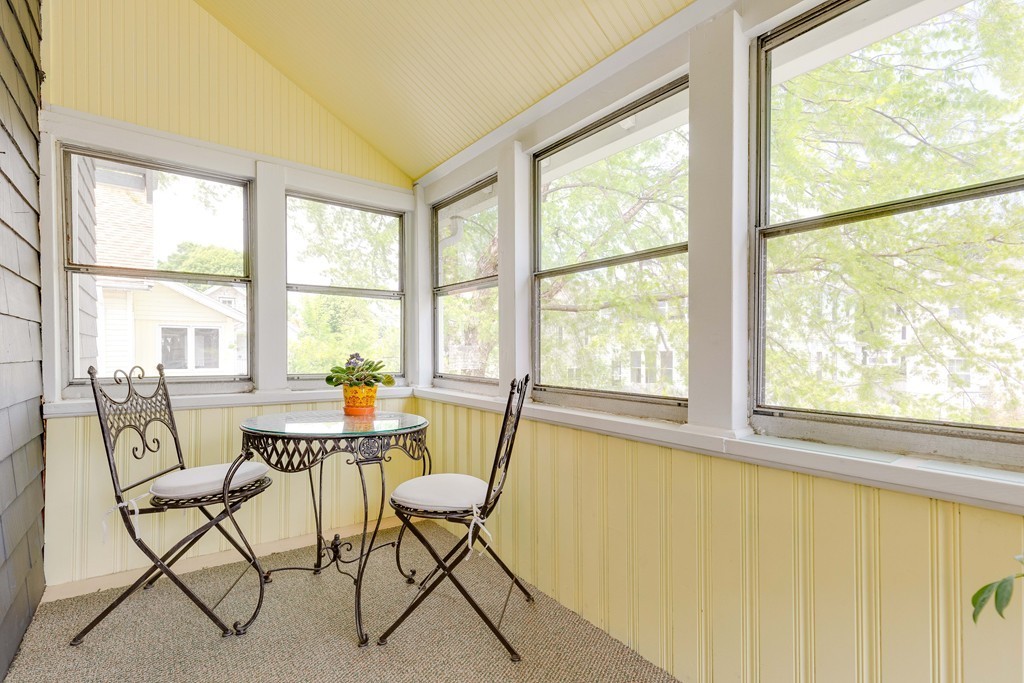 4 Hilltop Road Watertown, MA 02472 - Photo 15 of 27 a dining room with furniture and large windows
