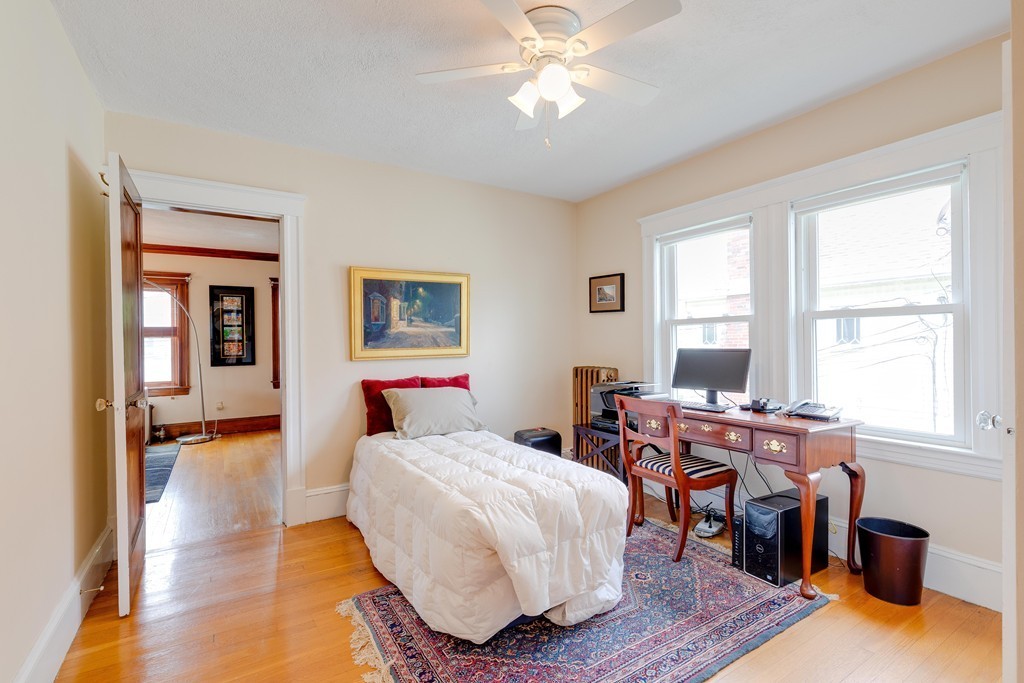 4 Hilltop Road Watertown, MA 02472 - Photo 18 of 27 a bed room with a bed and a window