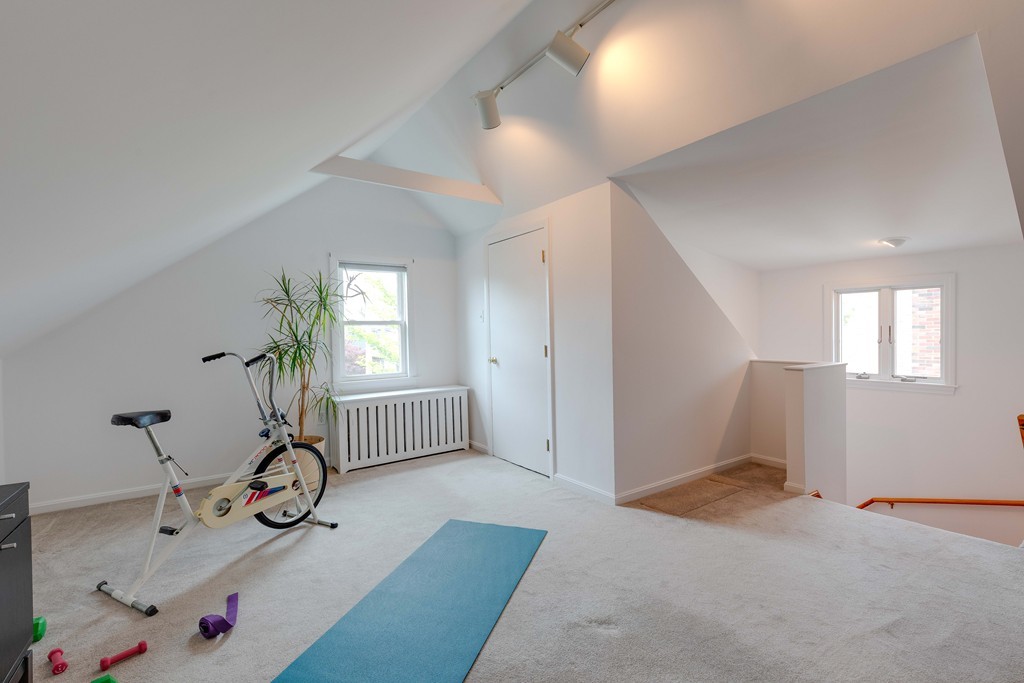 4 Hilltop Road Watertown, MA 02472 - Photo 20 of 27 a view of a livingroom with furniture and windows