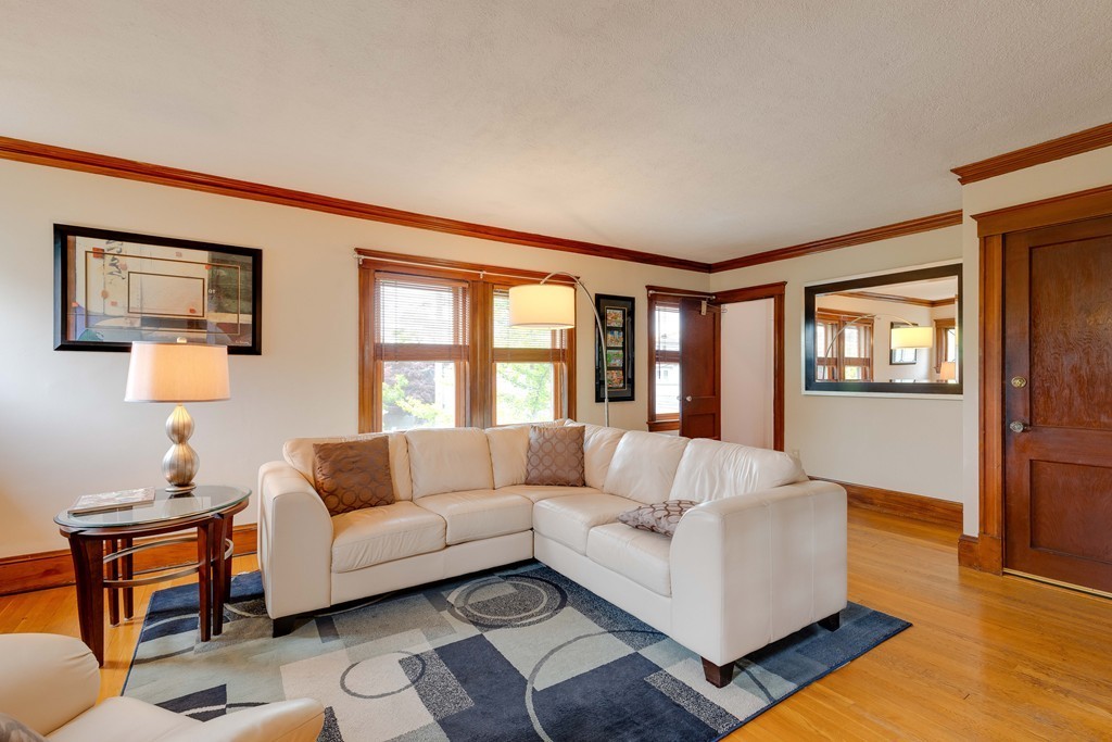 4 Hilltop Road Watertown, MA 02472 - Photo 2 of 27 a living room with furniture and a window