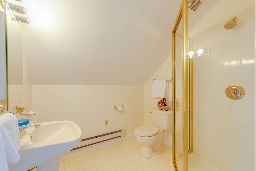 4 Hilltop Road Watertown, MA 02472 - Photo 23 of 27 a bathroom with a toilet sink and shower
