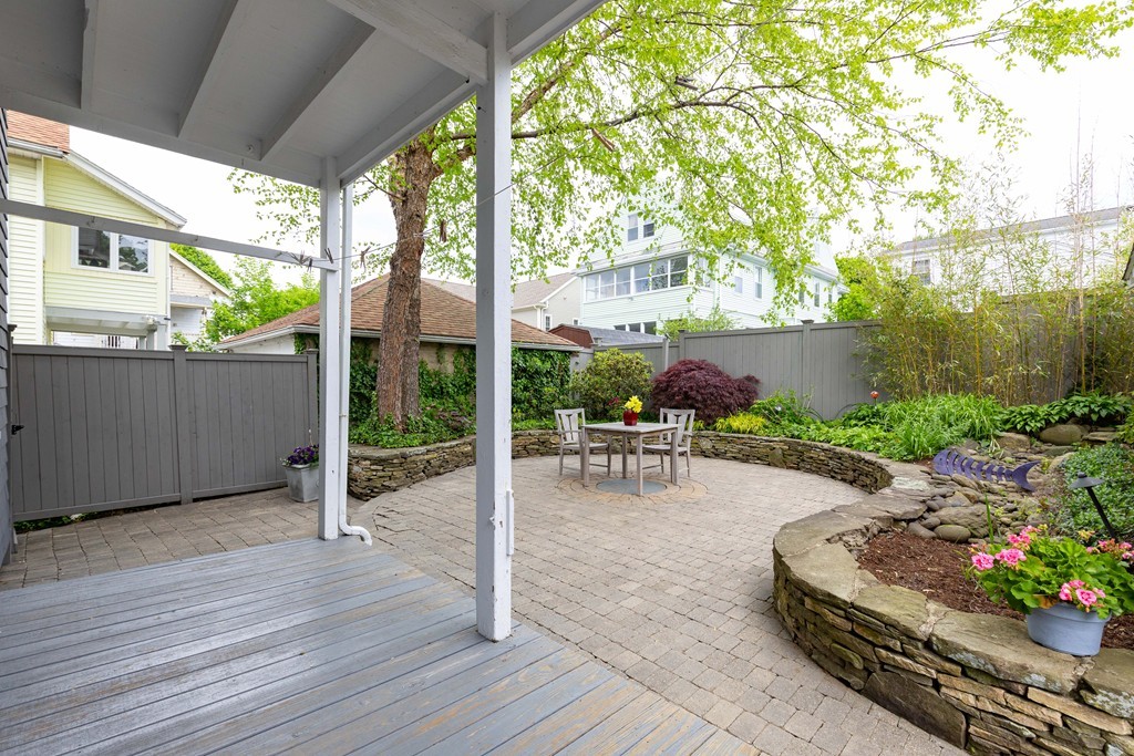 4 Hilltop Road Watertown, MA 02472 - Photo 24 of 27 a view of a backyard with sitting area