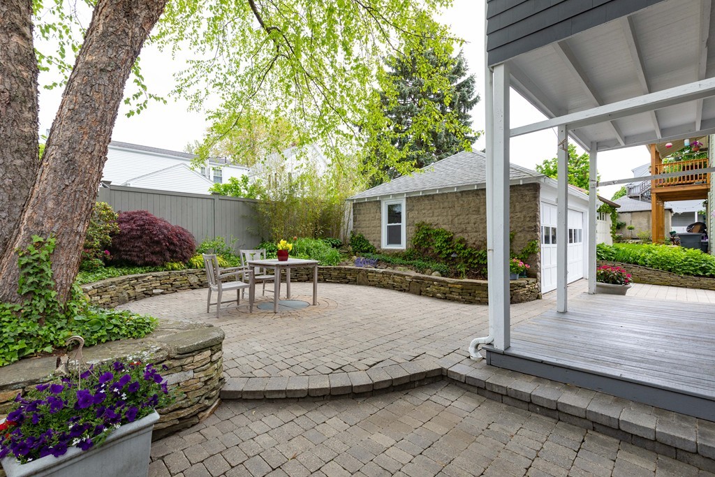 4 Hilltop Road Watertown, MA 02472 - Photo 25 of 27 a view of house with backyard and sitting area