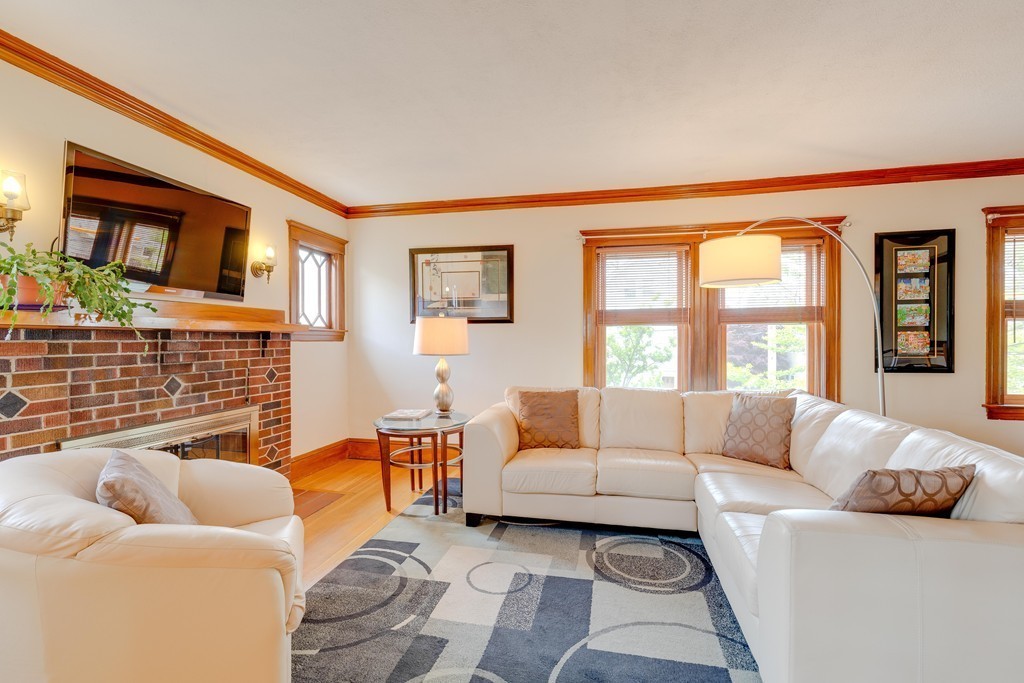 4 Hilltop Road Watertown, MA 02472 - Photo 3 of 27 a living room with furniture and a large window