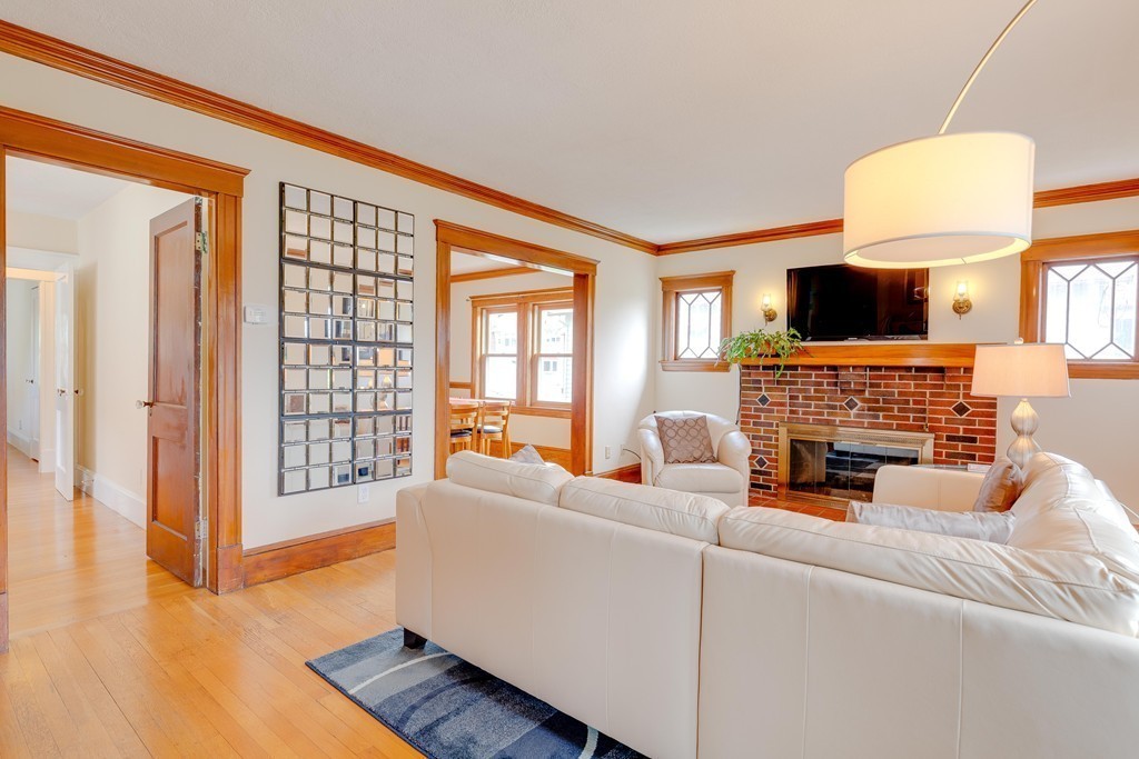 4 Hilltop Road Watertown, MA 02472 - Photo 5 of 27 a living room with furniture fireplace and a flat screen tv