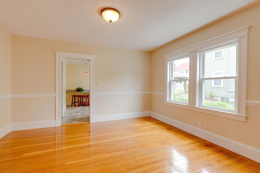 4 Hilltop Road Watertown, MA 02472 - Photo 8 of 27 an empty room with a empty space and a window