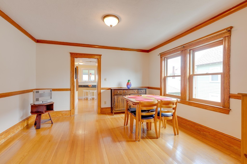 4 Hilltop Road Watertown, MA 02472 - Photo 10 of 27 a view of a dining room with furniture window and wooden floor