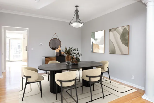 a dining room with furniture and window