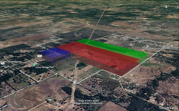 a aerial view of a house with a yard