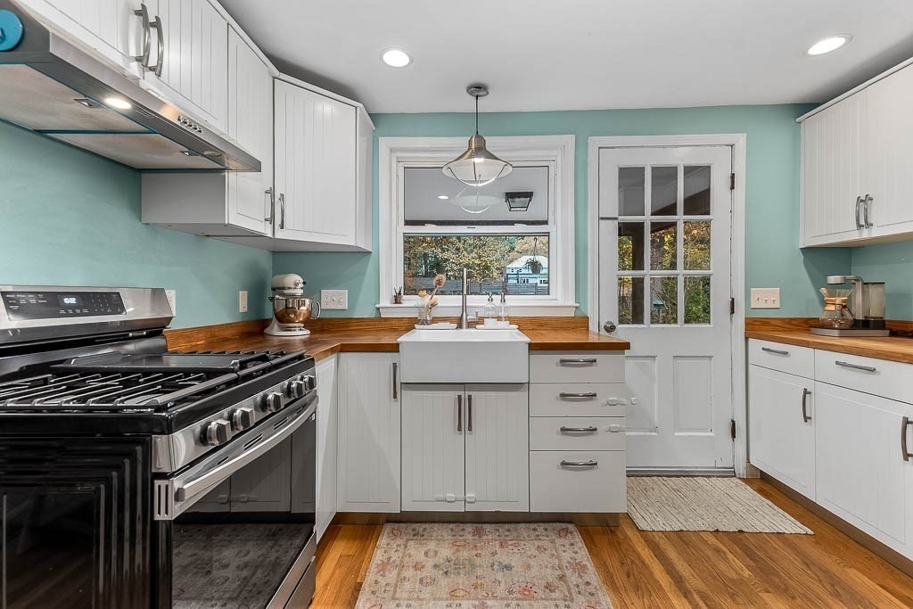 34 Cranberry Lane Dedham, MA 02026 - Photo 13 of 38 a kitchen with stainless steel appliances a stove a sink and a refrigerator